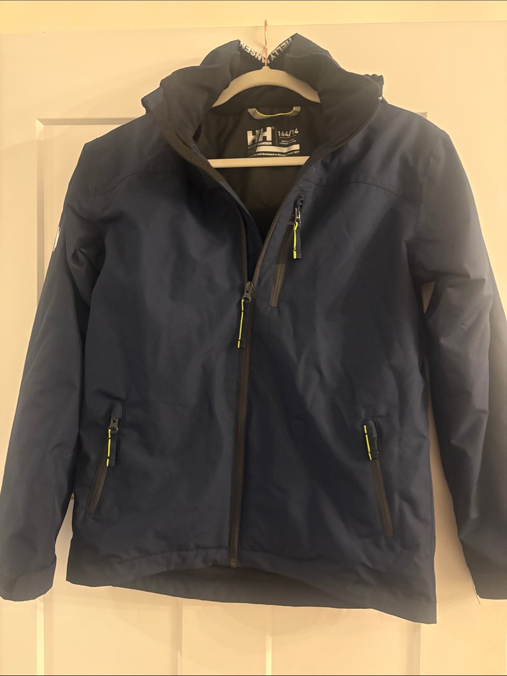 Helly Hansen size 14/164 Navy Jacket with Lime Zipper Accents - like new